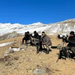 Snow Leopard Landscape with Photographers